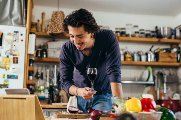 istock man preparing food at home 1389423127