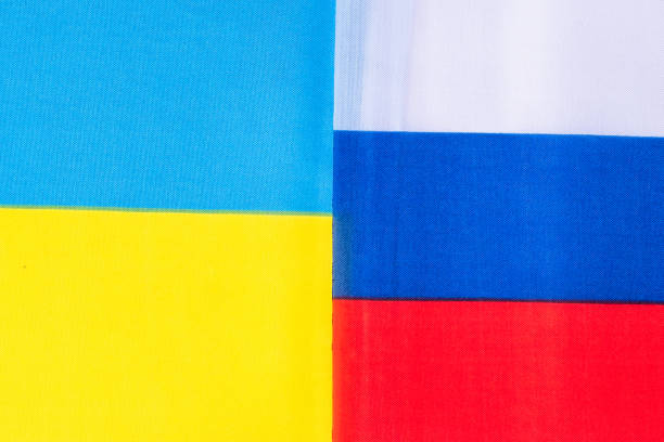 istock Ukraine. and Russia flags. Pray, No war, stop war, conflict and relationship concept 1389423183