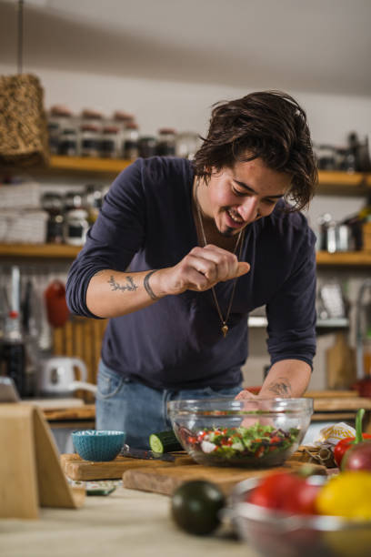 istock man preparing food at home 1389423794