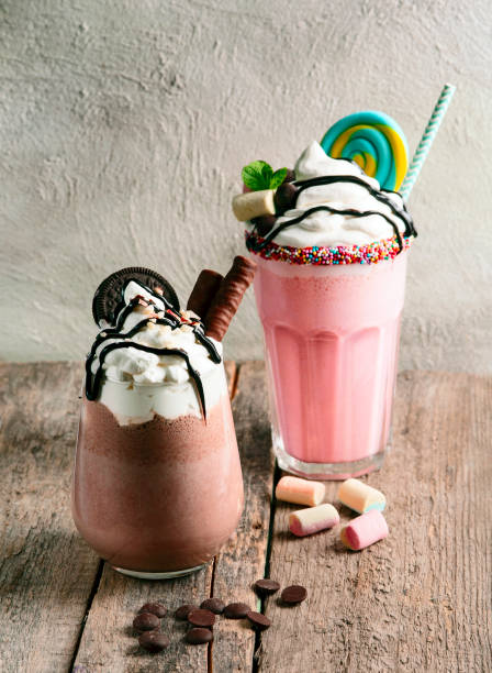 istock Milk chocolate cocktail and milk strawberry cocktail with sweets 1389427082