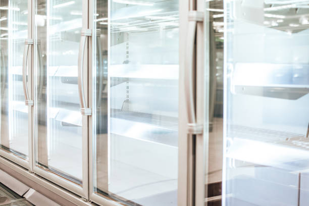 istock Empty refrigerator or freezer for food and grocery items in store. Selective focus. 1389431132
