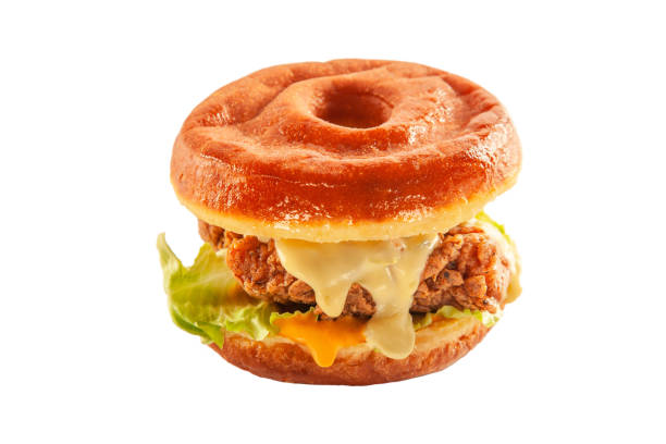 istock Donut burger bun with fried chicken patty melted cheese and dressing 1389431157