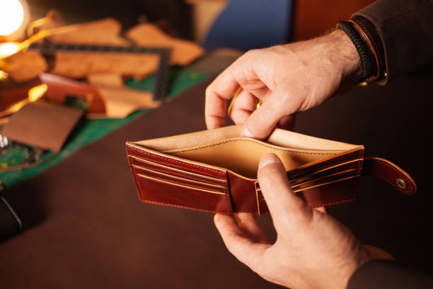 istock Beautiful genuine leather purse, leather workshop, with your own hands, DIY instruction, manual labor, professional work, goods for sale. brown 1389432596