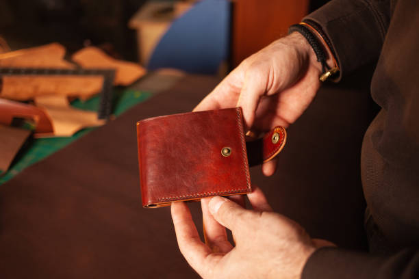 istock Beautiful genuine leather purse, leather workshop, with your own hands, DIY instruction, manual labor, professional work, goods for sale. gift for man 1389432611