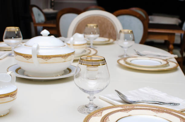 istock Beautiful empty dishes are on the table. The table is set for dinner. 1389433385