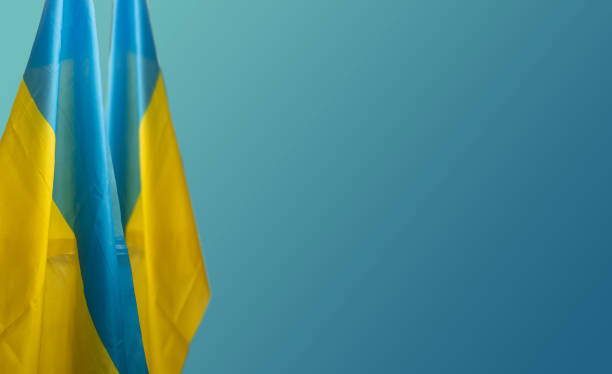 istock Ukraine flag Silk on blue background 1389433716