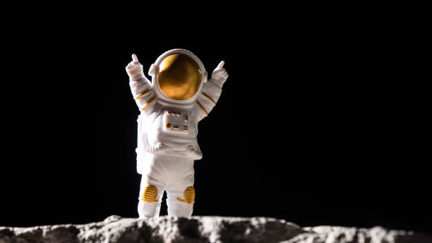 istock Spaceman on surface of rocks.  Astronaut in deep black space. 1389433722