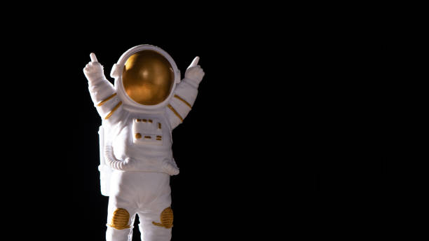istock Spaceman travels on black background, Astronaut outer space 1389433773