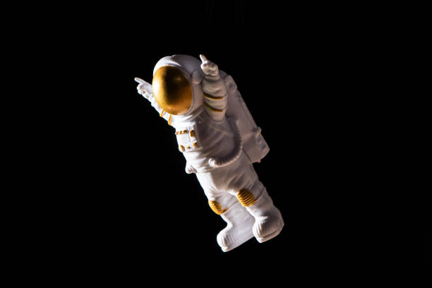 istock Spaceman travels on black background, Astronaut outer space 1389433775