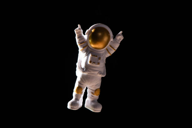 istock Spaceman travels on black background, Astronaut outer space 1389433803