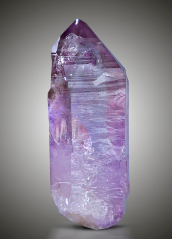 Quartz with mineral crystals photographed in the studio against a black background