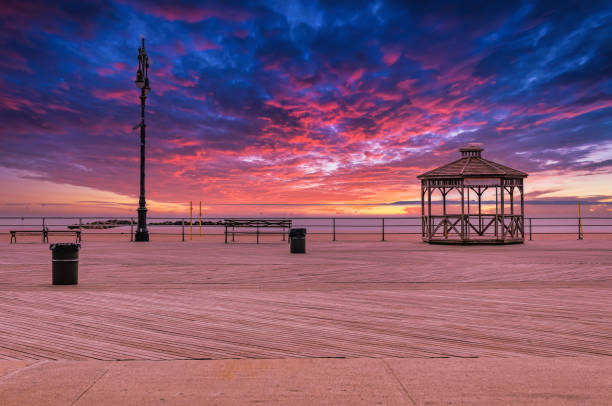 istock Coney Island beach with Pavilion and Boardwalk during sunset 1389438713