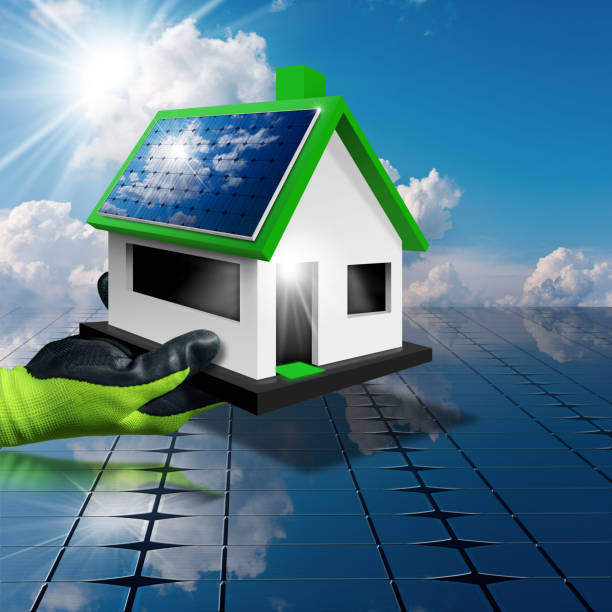 istock Gloved Hand Holding a Small Model House with Solar Panels 1389439785