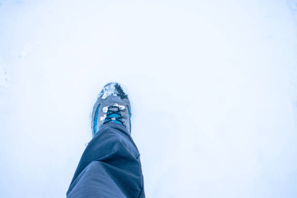 istock hiking boot treading on virgin snow 1389440592