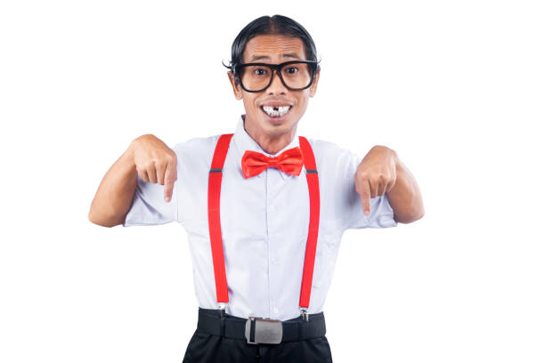 Asian nerd wearing glasses pointing something isolated over white background