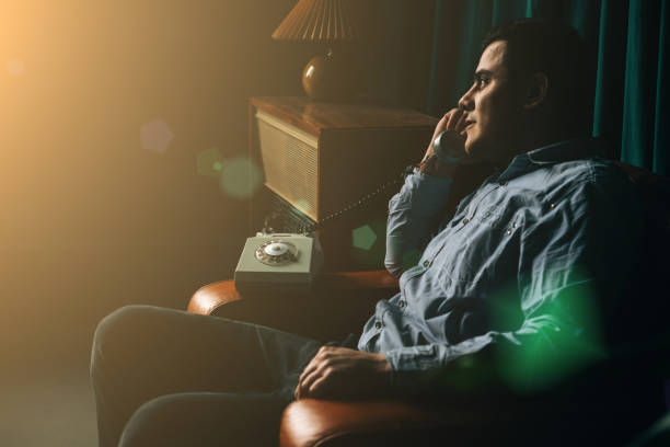 istock Special secret agent speaks by old phone. Spying or intelligence gathering. Espionage concept. Report information to superiors. 1389444203