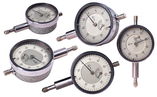 Dial gauge for a very precise examination of metal surfaces. Isolated background.
