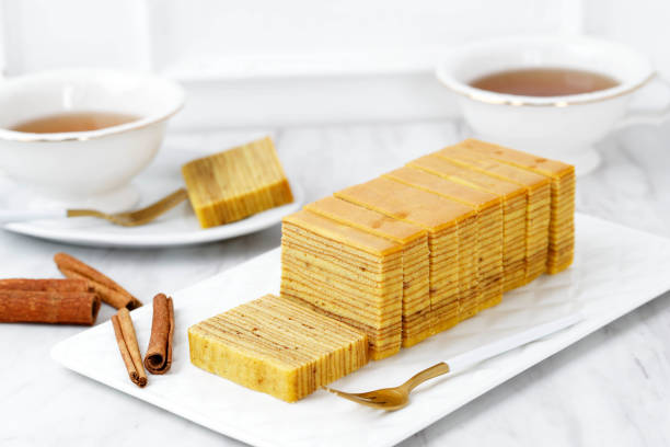 Indonesian Thousand Layer Cake or Lapis Legit. Indonesian Thousand Layer Cake or Lapis Legit. Usually Served on Lebaran, Natal, and Imlek. Served with Tea, White Background Bakery Concept kayu manis stock pictures, royalty-free photos & images