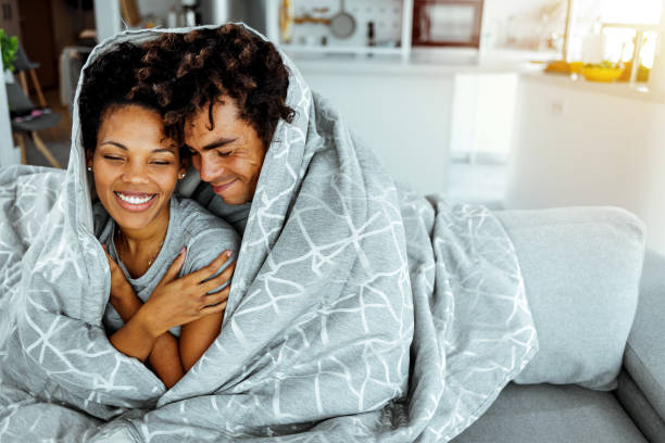 black couple in love laughing - winter women zen like photography imagens e fotografias de stock