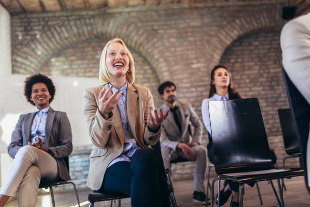 istock Business people attending seminar in modern office 1389446445