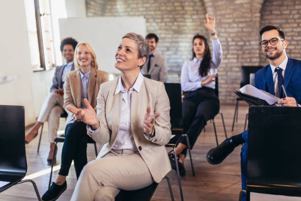 istock Business people attending seminar in modern office 1389446457