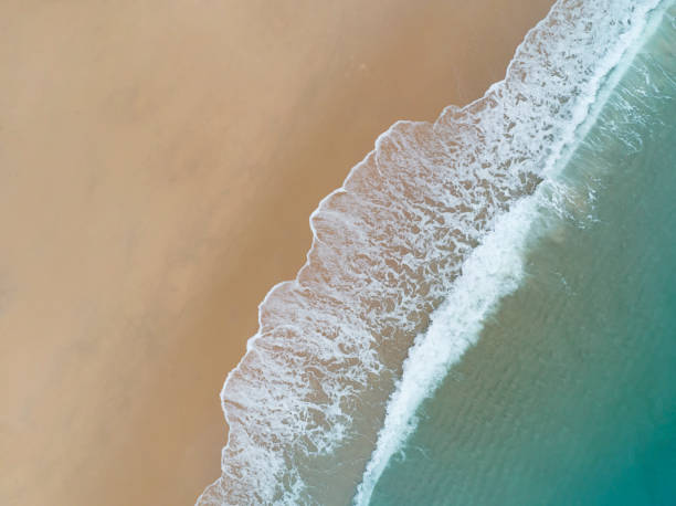 istock Aerial view  beach wave on tropical sea in summer time background 1389448123