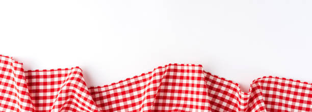 Gingham cloth on white background with copyspace. Banner stock photo