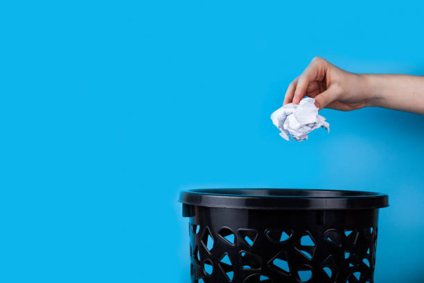 istock White crumpled paper beacons are thrown in the trash can. 1389452006