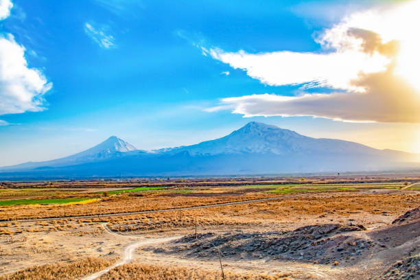 istock Beautiful mountain and fiery sunset. Blue sky with clouds 1389452029