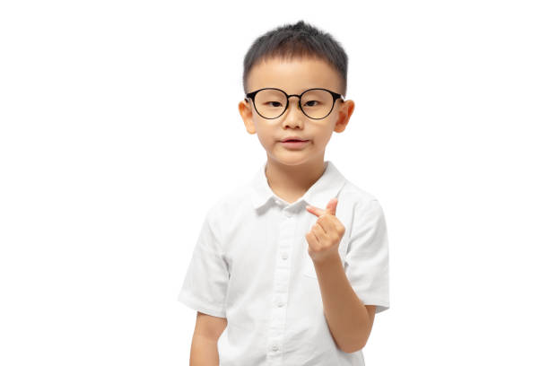 istock Kid showing mini heart wearing white shirt 1389453501