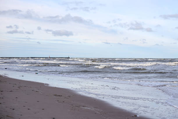 istock Baltic sea shoreside view with waves and cloudy weather. 1389453764