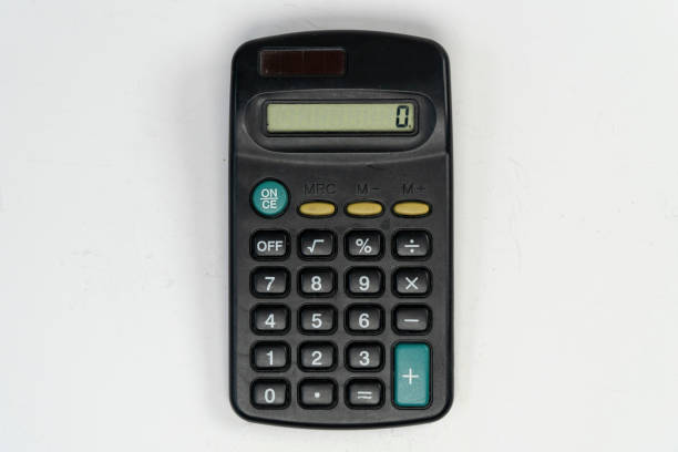 istock Mini electronic calculator, hand size calculator with solar energy panel, isolated on white background 1389453943