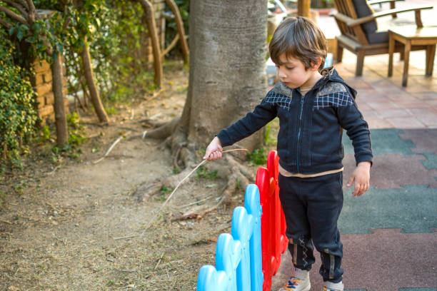 istock Happy little boy playing in playground 1389454841
