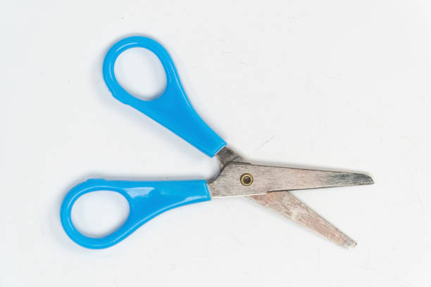 istock Blue opened scissors isolated on white background, small a pair of scissors, cutting tool top view 1389454912