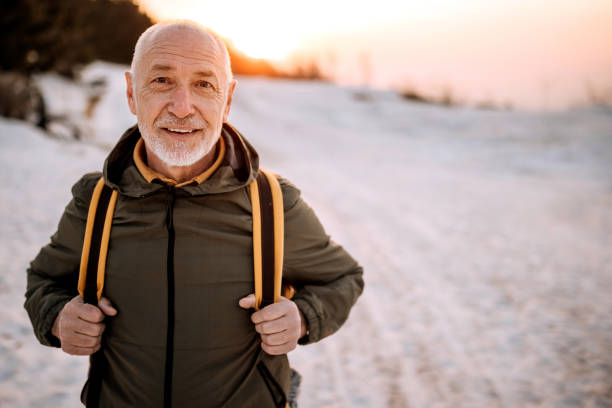 istock Senior hiker portrait on the mountain 1389456773