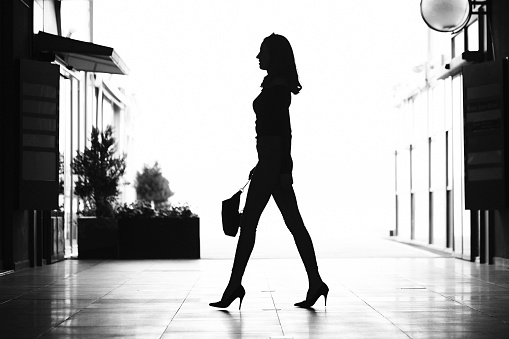 silhouette of woman walking