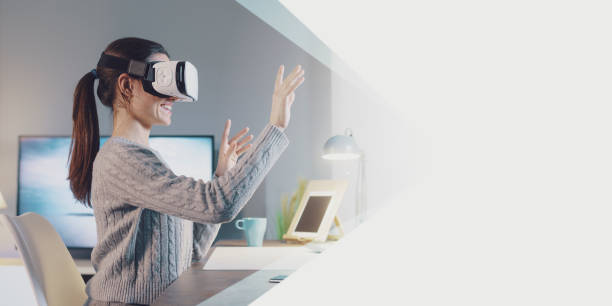 istock Young woman interacting with VR 1389457700