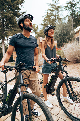 happiness couple with mountain ebike outdoors