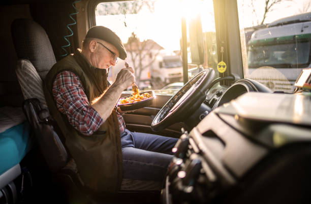 trucker on break from driving - truck driver highway truck working imagens e fotografias de stock