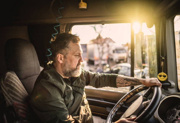 istock Man driving a truck 1389463889