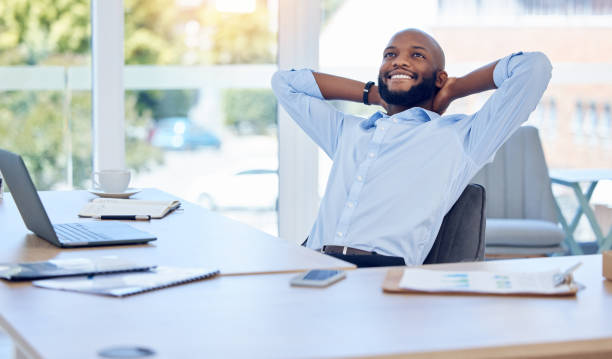 istock Shot of a young businessman resting while working in a modern office 1389465699
