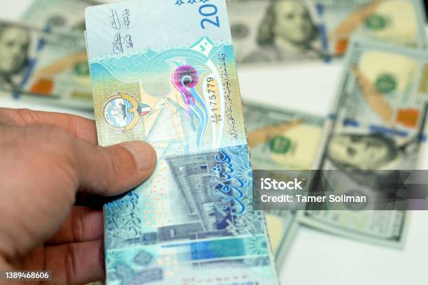 Man Hand Holding A Stack Of 20 Twenty Kuwaiti Dinars Banknotes Money Spending Giving And Using Money Concept Paying And Buying Stock Photo - Download Image Now