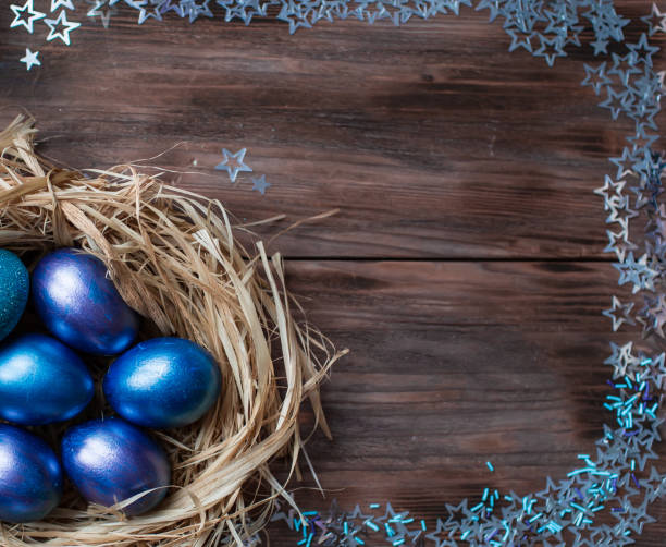 istock Blue Easter eggs in a nest on a wooden background. Easter card with a place to copy the text. The concept of bright Easter. 1389468616