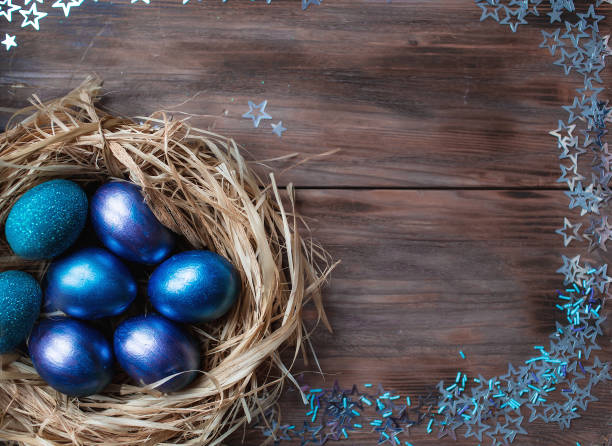 istock Blue Easter eggs in a nest on a wooden background. Easter card with a place to copy the text. The concept of bright Easter. 1389468619