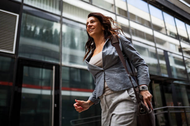 istock Business woman running 1389470063