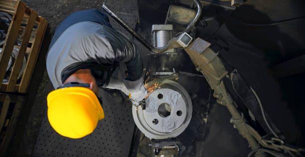 istock Worker grinding in steel mill 1389470300