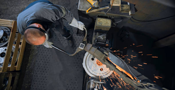 istock Worker grinding in steel mill 1389470308