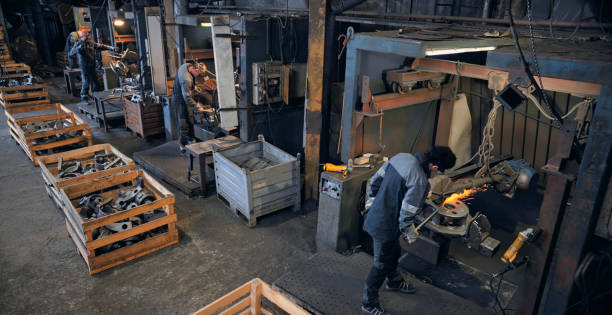 istock Workers grinding in steel mill 1389470319