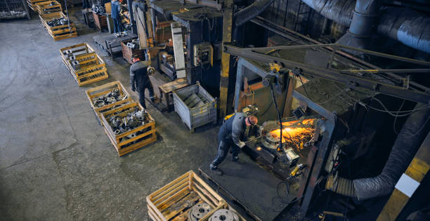 Welders working in factory