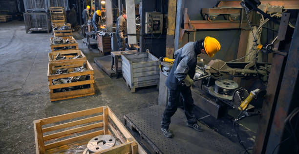 istock Workers grinding in steel mill 1389470327